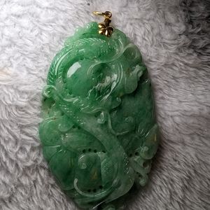 Jade pendant. Carved with full dragon
